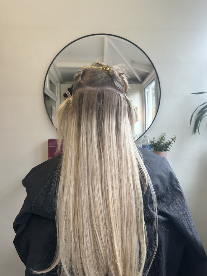 Tape extensions being fitted